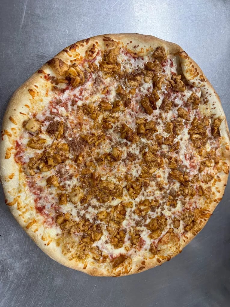 A freshly baked pizza with melted cheese and golden crust at Elizabeth’s Pizza in Lexington