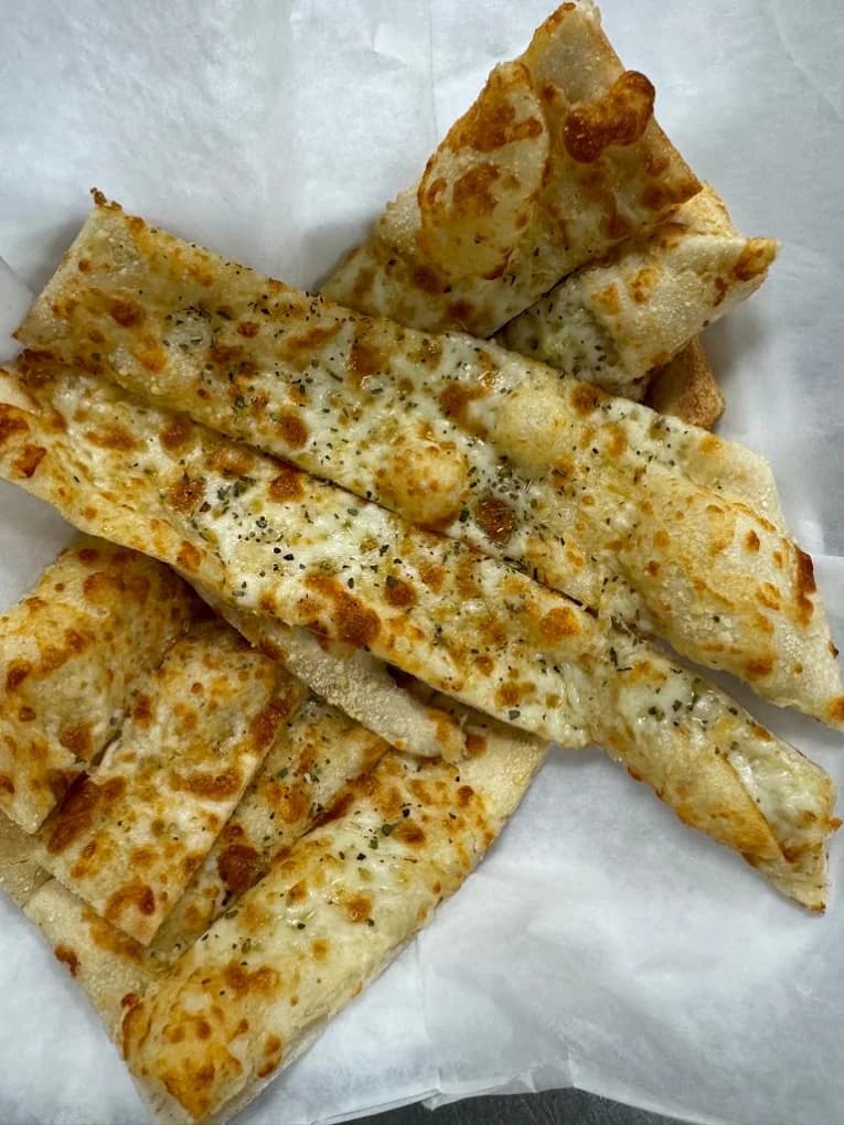 Garlic bread slices topped with melted cheese and herbs